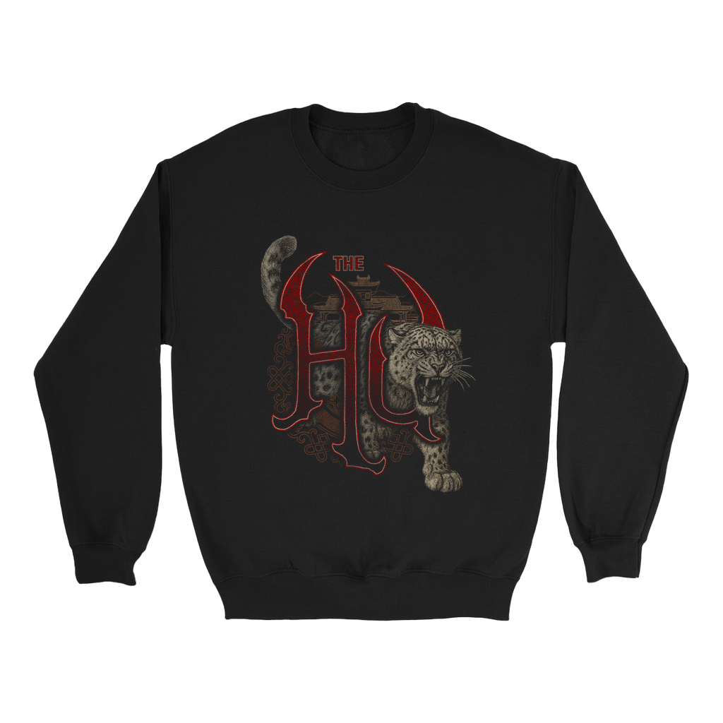 Snow leopard bursting through red The Hu logo on a black pullover crewneck sweatshirt.
