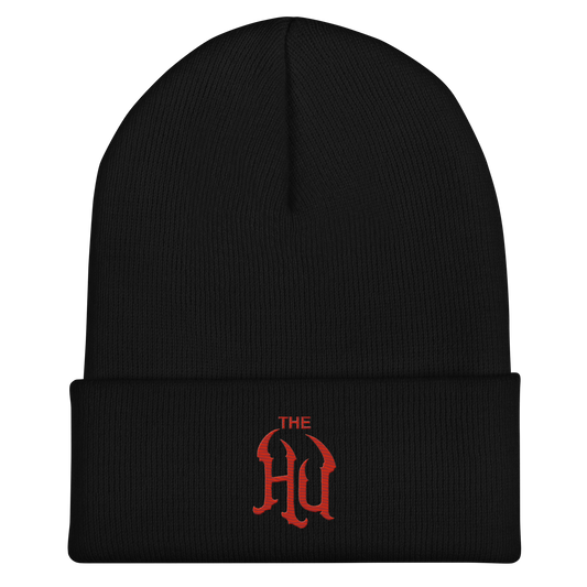 A black ribbed knit beanie with a folded cuff, featuring a red embroidered gothic-style 'THE HU' logo on the front cuff, set against a plain white background.